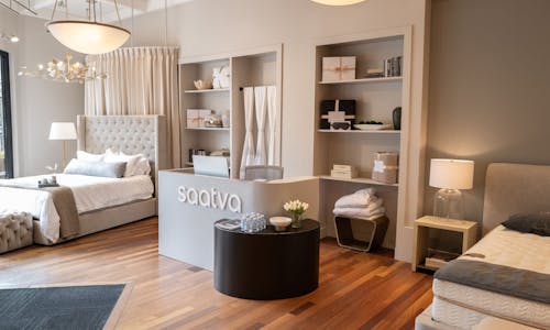 The inviting, serene and luxurious Welcome Desk and Bedding Accessories areas in the Saatva San Diego Viewing Room.