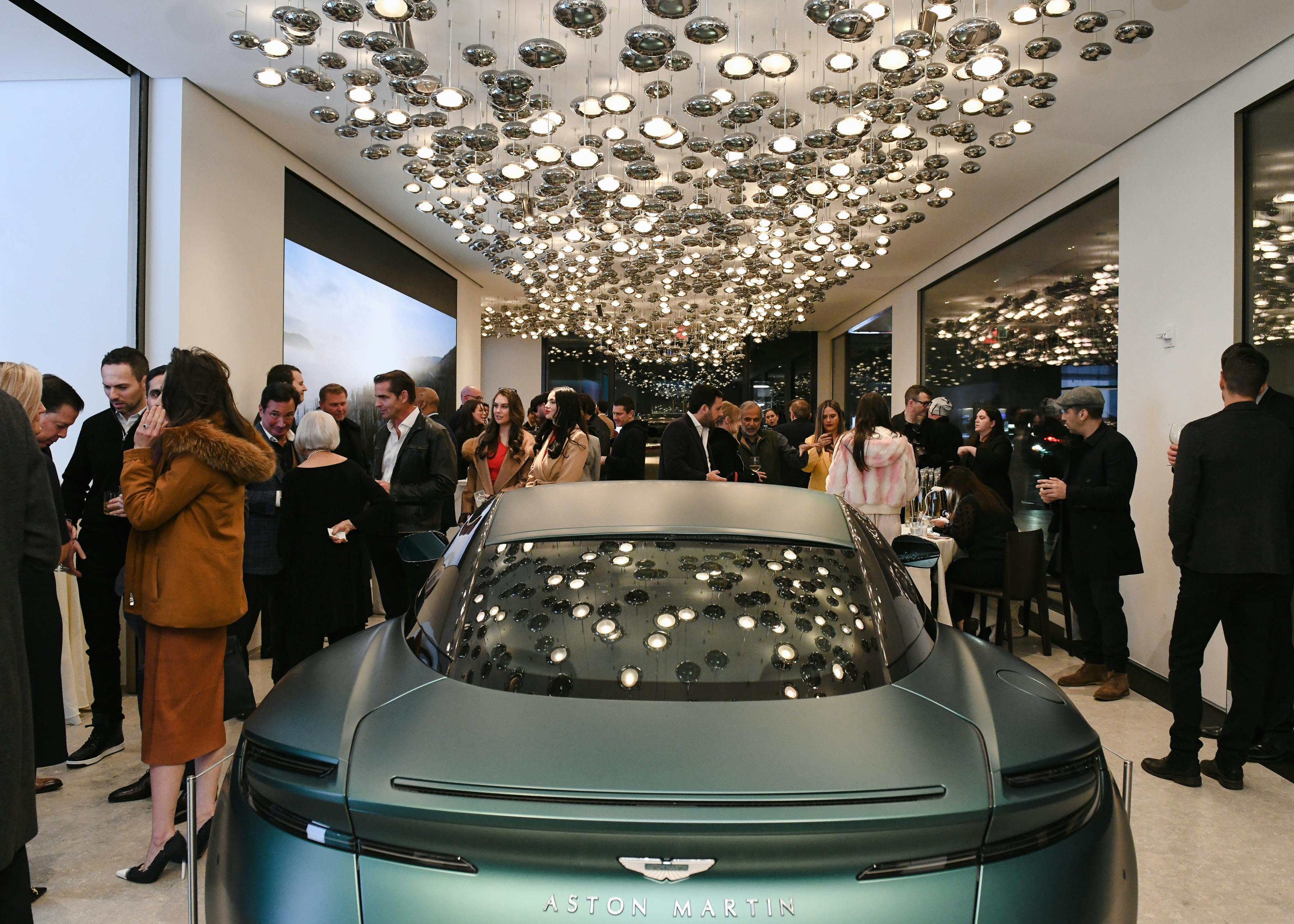 Aston Martin's Q New York showroom on Park Avenue with Elite Traveler Magazine's Watch Issue guests enjoying the ultra luxury new space