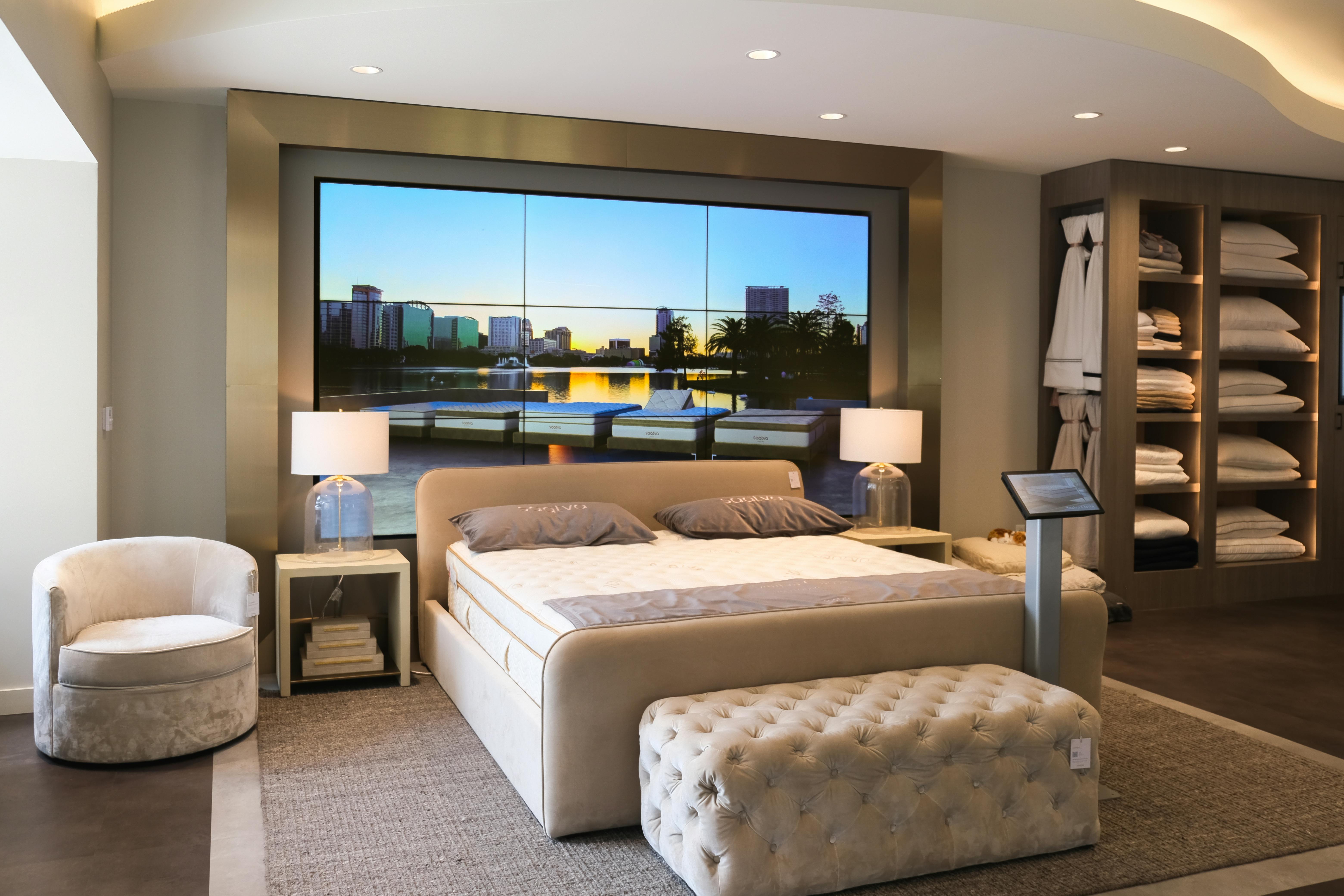 Saatva Orlando's Hero Bed display, comprised of nine high-definition Samsung displays that form a customizable digital headboard