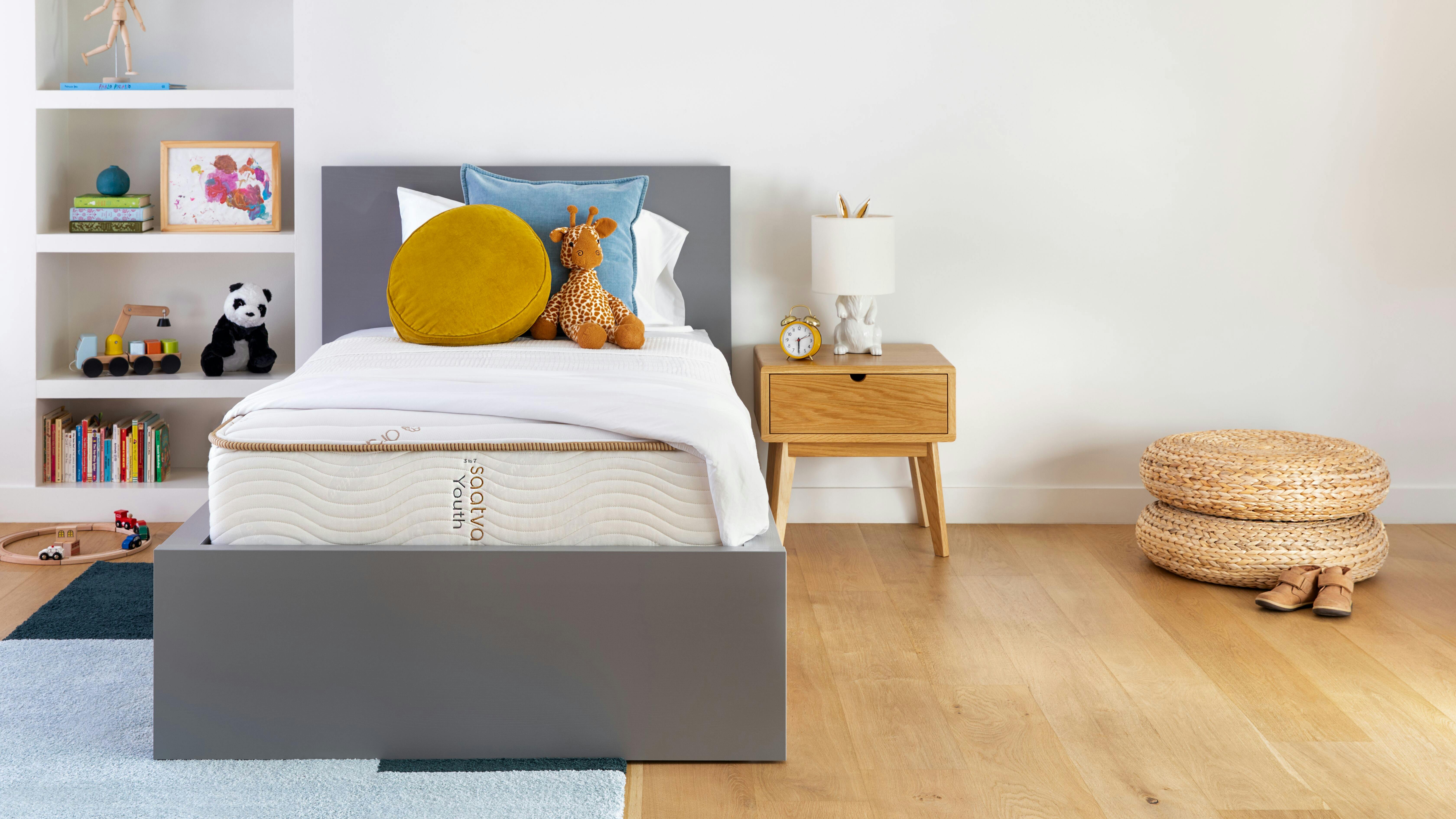 The dual-sided, eco-friendly Saatva Youth Mattress in a child's bedroom