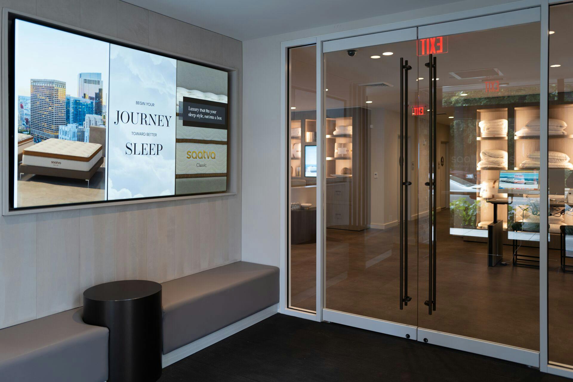 The Saatva's Seattle's Viewing Room foyer is illuminated with Samsung displays that share the latest news about its award-winning products.