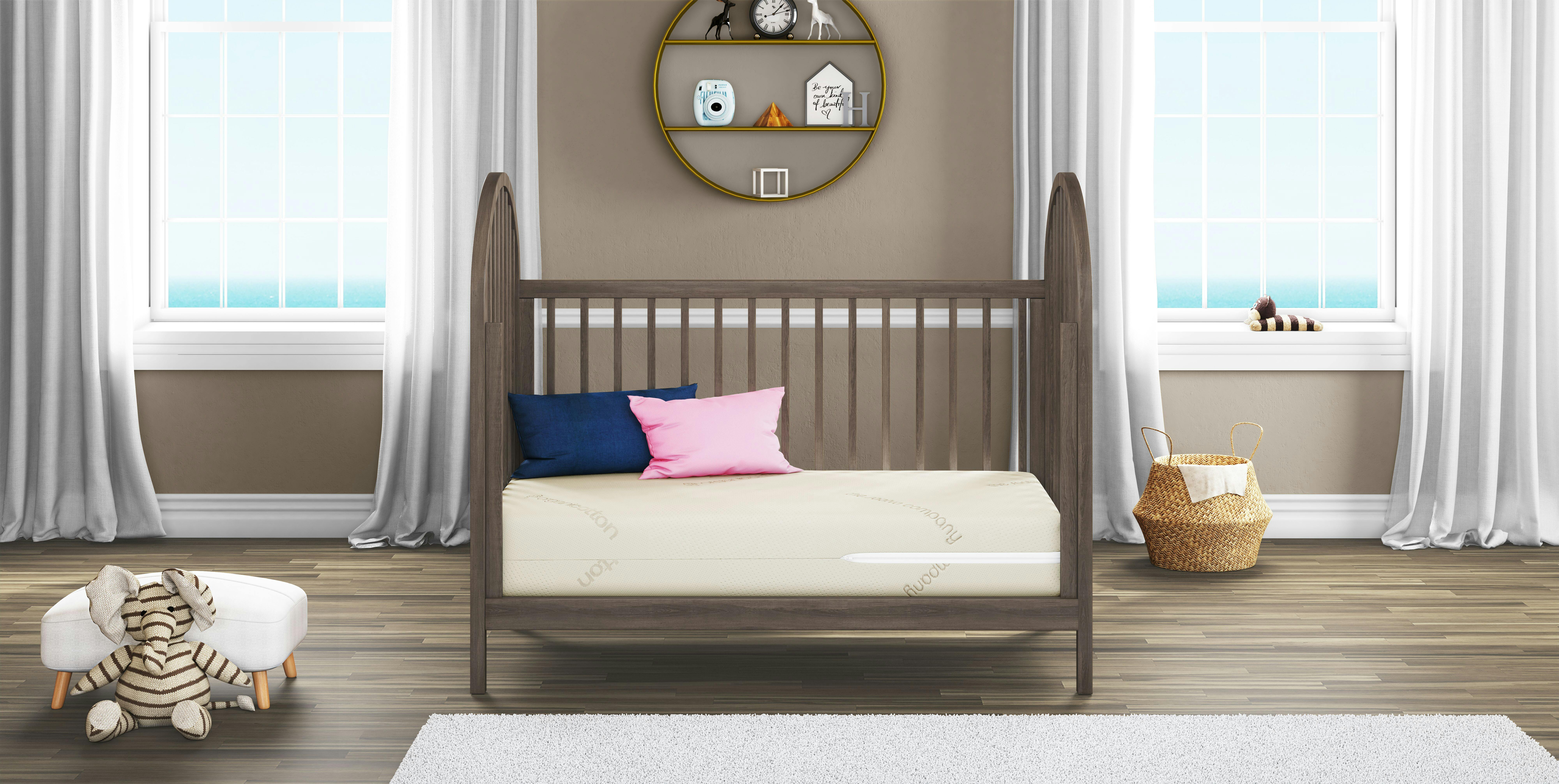 A shot of Saatva's noteworthy crib mattress in a beautifully decorated kids room.