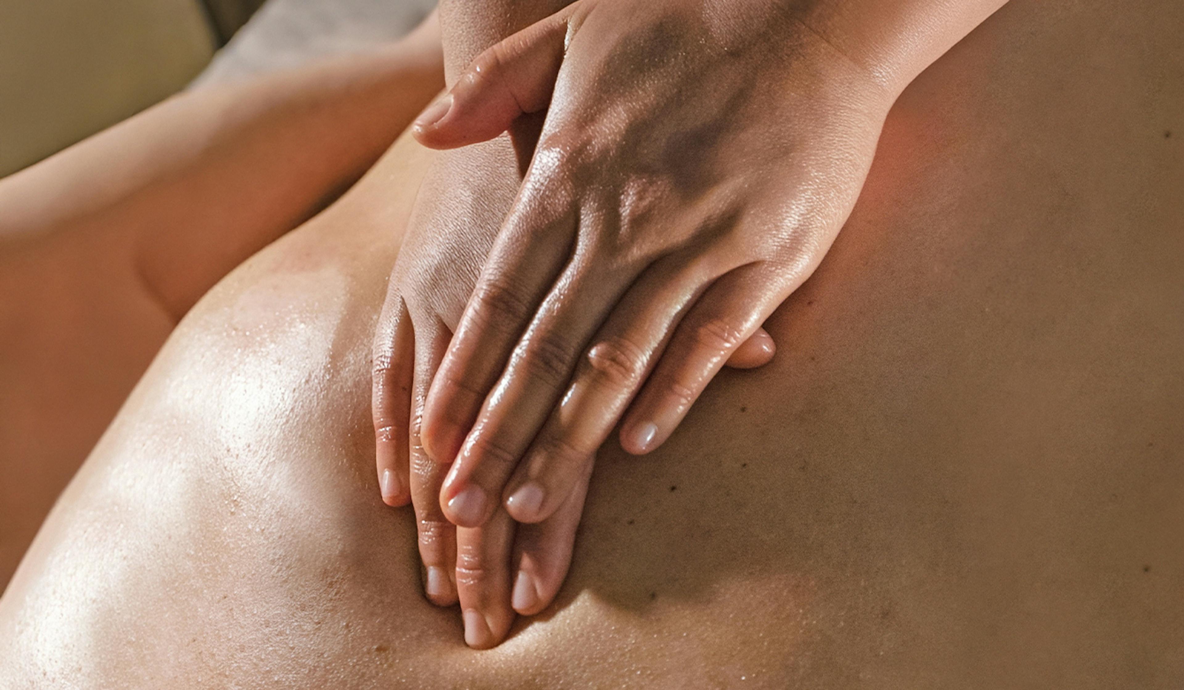 Therapist using forearm to perform deep tissue massage on a client’s back at Sabai Sabai Thai Massage in Split — releasing tension in targeted muscle groups.