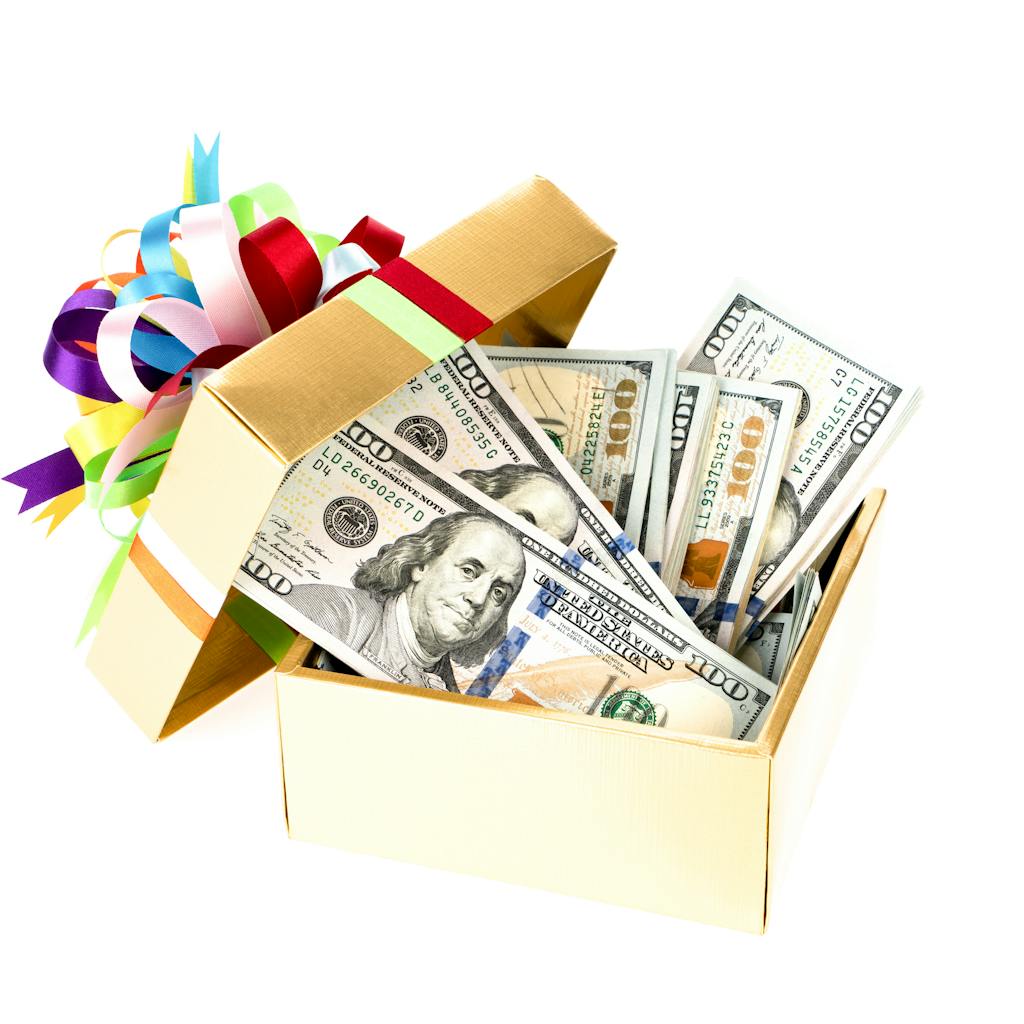 Hundred dollar bills in a decorated gift box <a href="https://www.freepik.com/photos/background">Background photo created by jannoon028 - www.freepik.com</a>