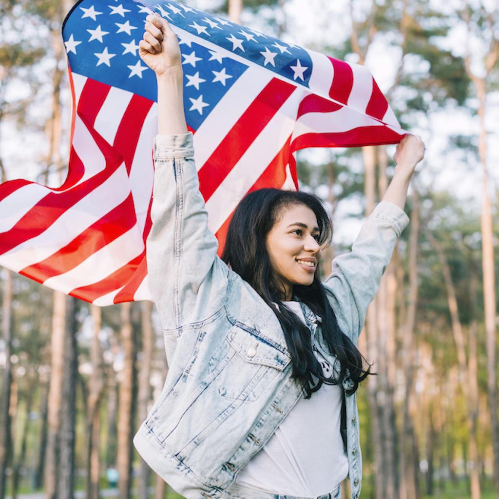 Girl waving a United States flag