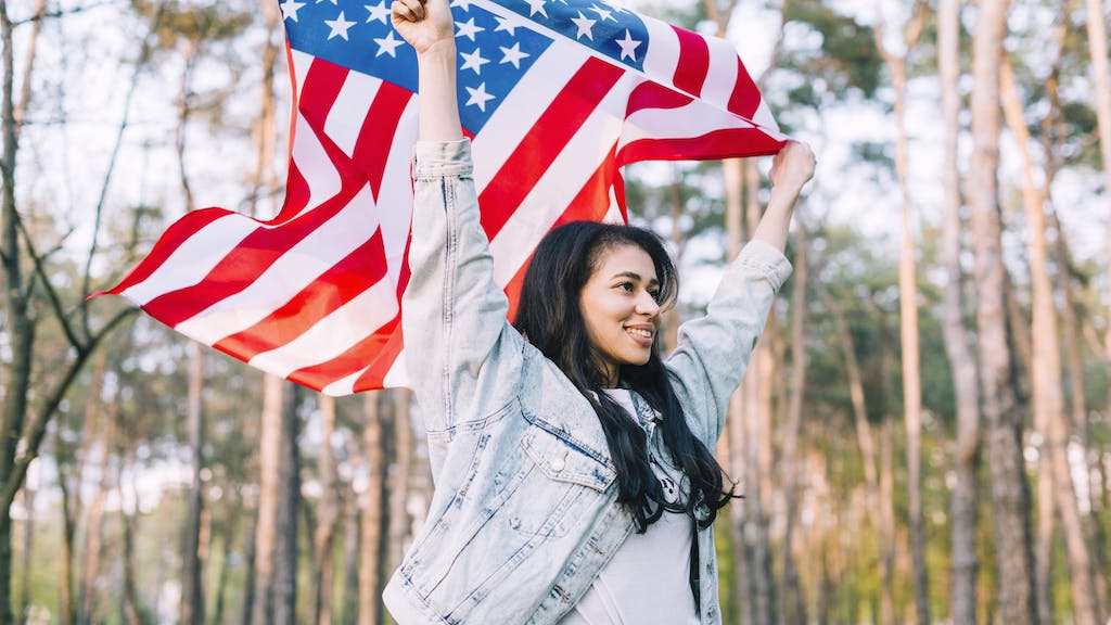 Girl waving a United States flag