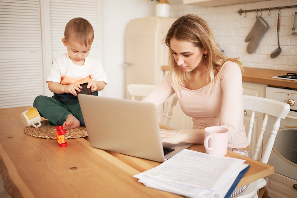 Young blonde female sitting at kitchen table with papers and portable computer with her baby son while he is staying at home with her<a href="https://www.freepik.com/free-photo/worried-upset-young-blonde-female-sitting-kitchen-table-with-papers-portable-computer-feeling-stressed-because-she-has-make-report-take-care-her-baby-son-while-he-is-staying-home_11193269.htm#query=child%20tax%20credit&position=23&from_view=search&track=ais&uuid=08752235-bf7d-475f-ac41-b4bcf0edd23d">Image by shurkin_son</a> on Freepik