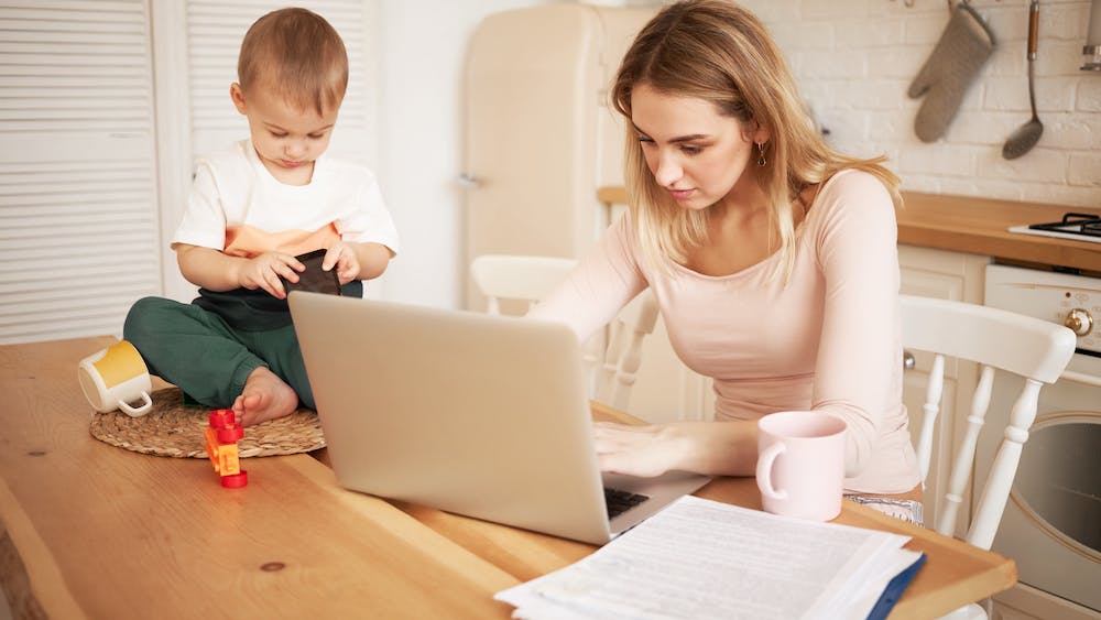 Young blonde female sitting at kitchen table with papers and portable computer with her baby son while he is staying at home with her<a href="https://www.freepik.com/free-photo/worried-upset-young-blonde-female-sitting-kitchen-table-with-papers-portable-computer-feeling-stressed-because-she-has-make-report-take-care-her-baby-son-while-he-is-staying-home_11193269.htm#query=child%20tax%20credit&position=23&from_view=search&track=ais&uuid=08752235-bf7d-475f-ac41-b4bcf0edd23d">Image by shurkin_son</a> on Freepik