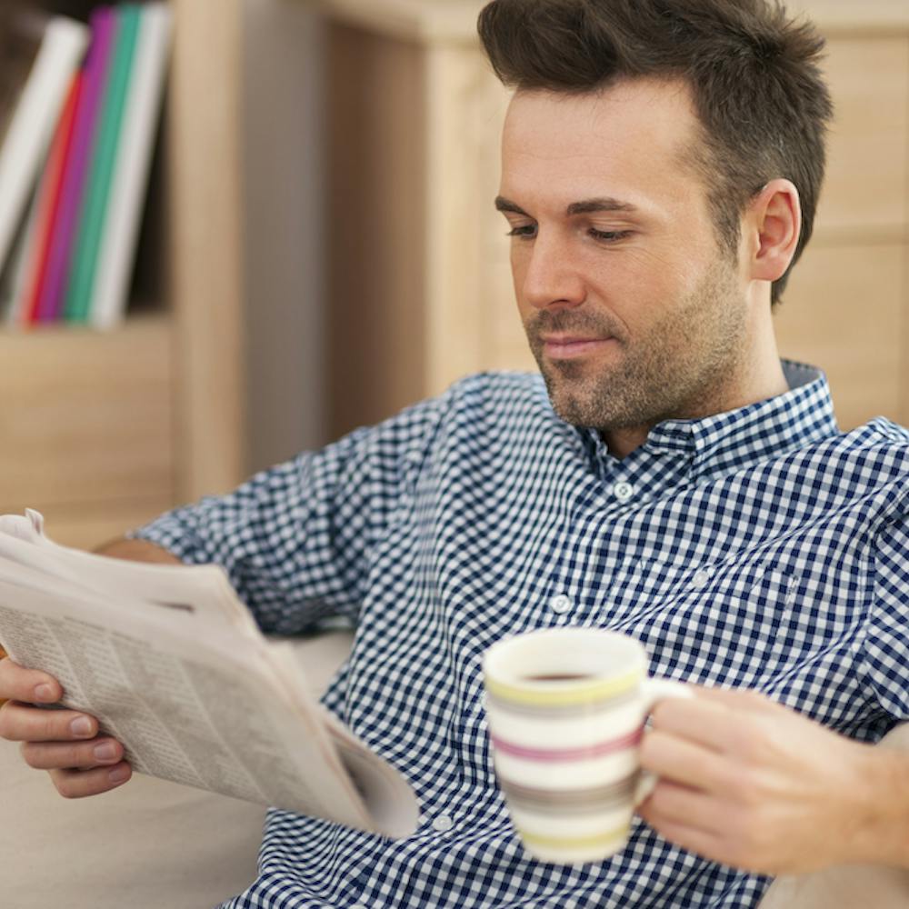 Smiling man with newspaper reading the news with a cup of coffee:  <a href="https://www.freepik.com/free-photo/smiling-man-with-newspaper-cup-coffee_10676551.htm#page=3&query=tax%20updates%20good%20news&position=21&from_view=search&track=ais&uuid=40d61f3a-86d5-4e14-aa64-c42b548446ac">Image by gpointstudio</a> on Freepik