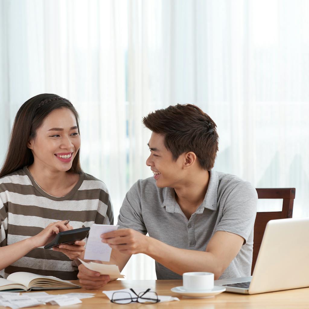 Young couple managing their budget at home