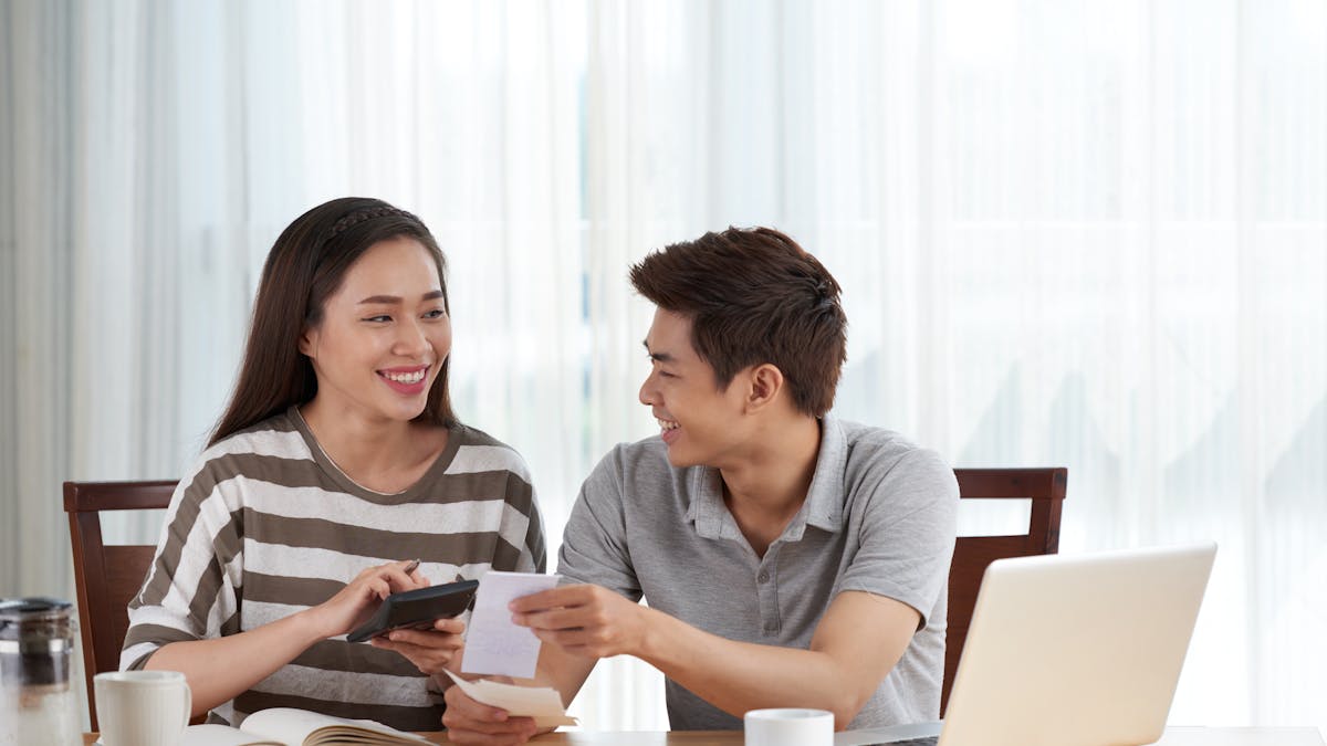 Young couple managing their budget at home