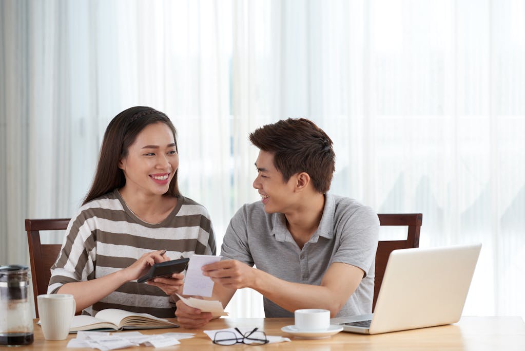 Young couple managing their budget at home