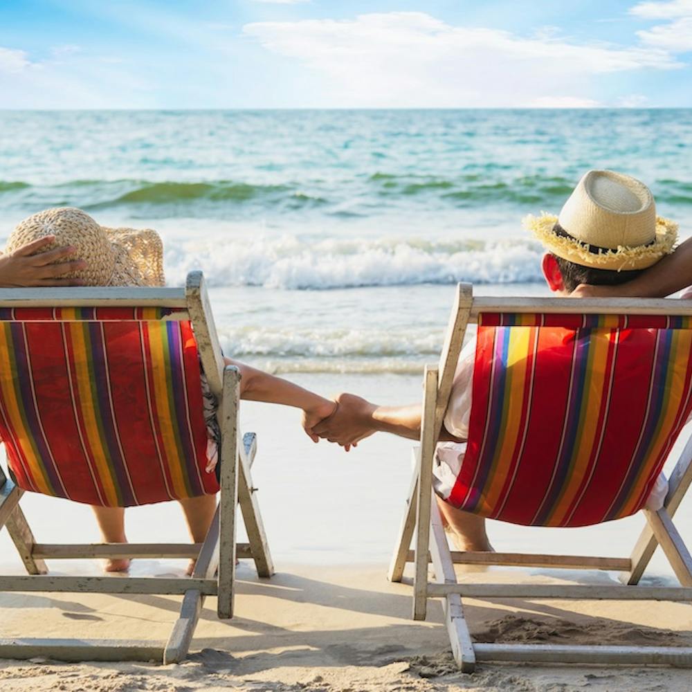 Relax couple lay down on beach chair with sea wave - man and woman have vacation at sea nature- https://www.freepik.com/free-photo/relax-couple-lay-down-beach-chiar-with-sea-wave-man-woman-have-vacation-sea-nature-concept_5073614.htm#page=2&query=island%20retirement&position=40&from_view=search&track=ais