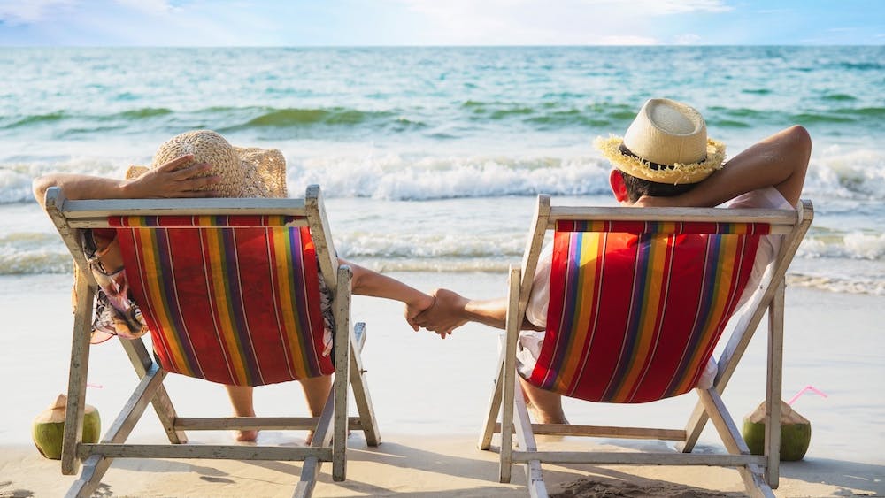 Relax couple lay down on beach chair with sea wave - man and woman have vacation at sea nature- https://www.freepik.com/free-photo/relax-couple-lay-down-beach-chiar-with-sea-wave-man-woman-have-vacation-sea-nature-concept_5073614.htm#page=2&query=island%20retirement&position=40&from_view=search&track=ais