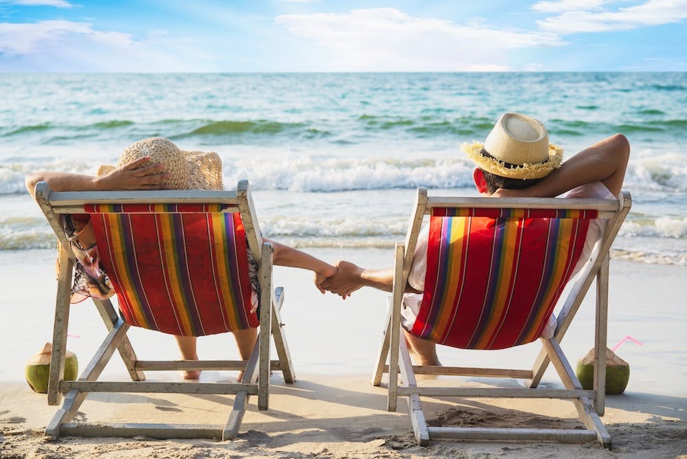 Relax couple lay down on beach chair with sea wave - man and woman have vacation at sea nature- https://www.freepik.com/free-photo/relax-couple-lay-down-beach-chiar-with-sea-wave-man-woman-have-vacation-sea-nature-concept_5073614.htm#page=2&query=island%20retirement&position=40&from_view=search&track=ais
