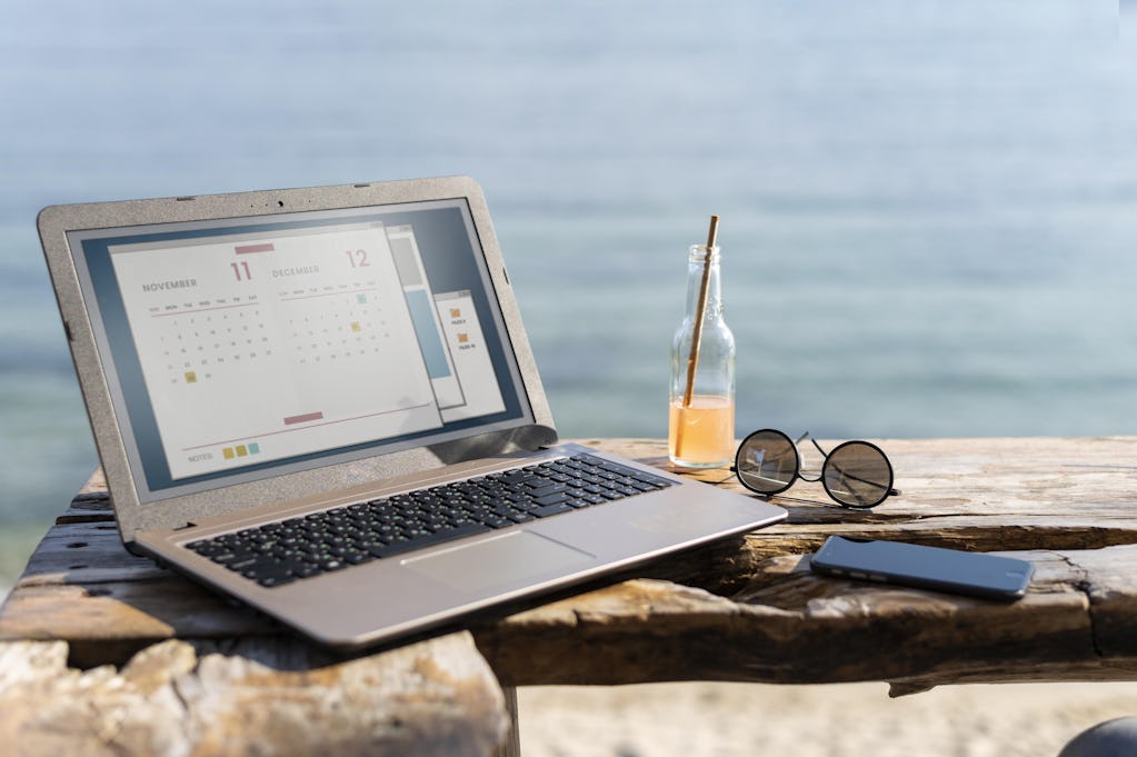 Laptop at seaside Image by <a href="https://www.freepik.com/free-photo/arrangement-with-laptop-seaside_14288139.htm#from_view=detail_serie">Freepik</a>