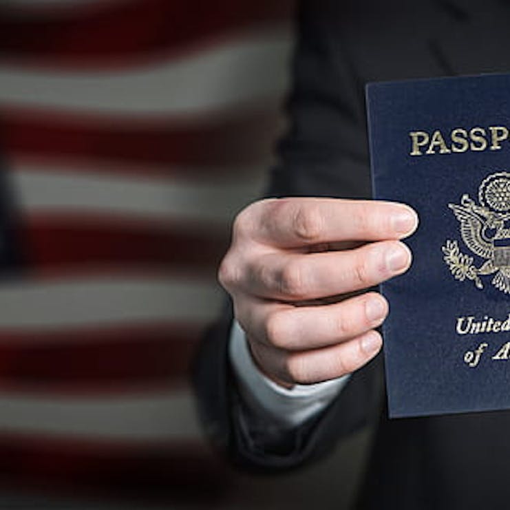 Person holding and showing a United States passport