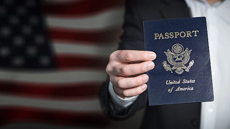 Person holding and showing a United States passport