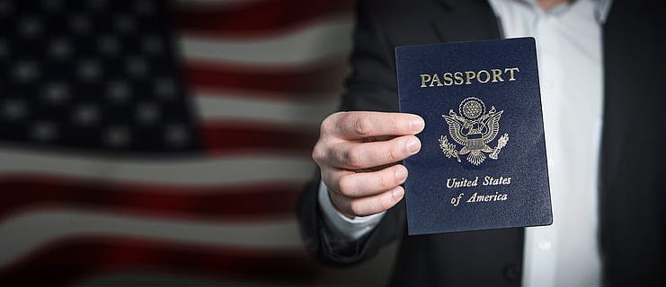 Person holding and showing a United States passport