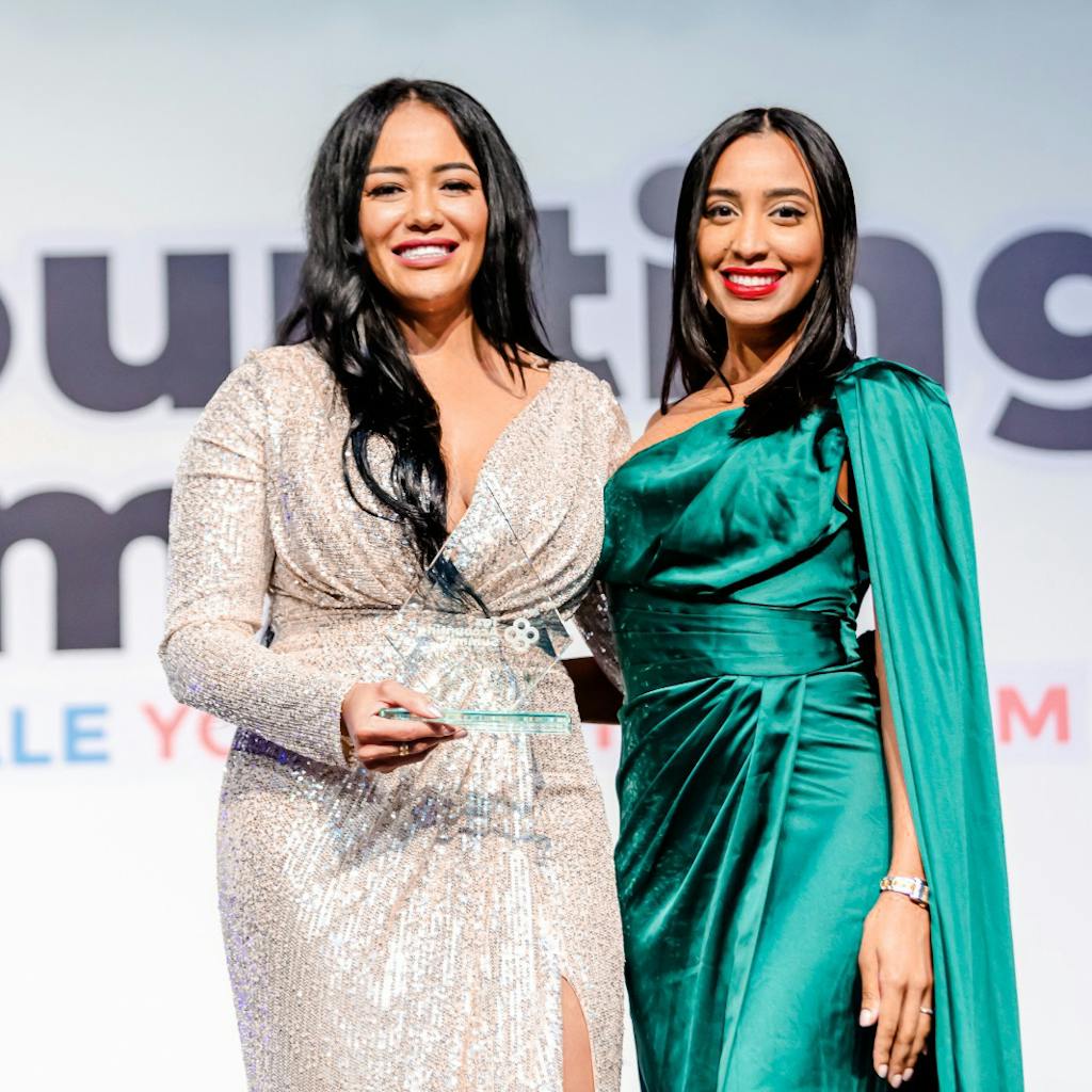 Alexandra receiving a prize in the tax accounting summit