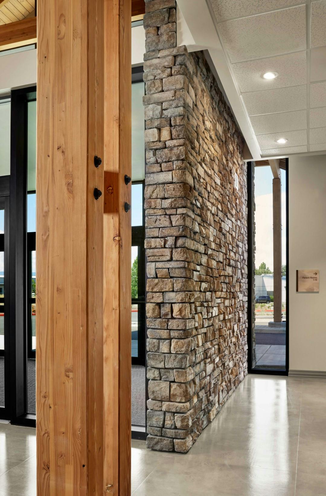 Example of the wood and stone textures present in the lobby of the OOC ambulatory surgery center.