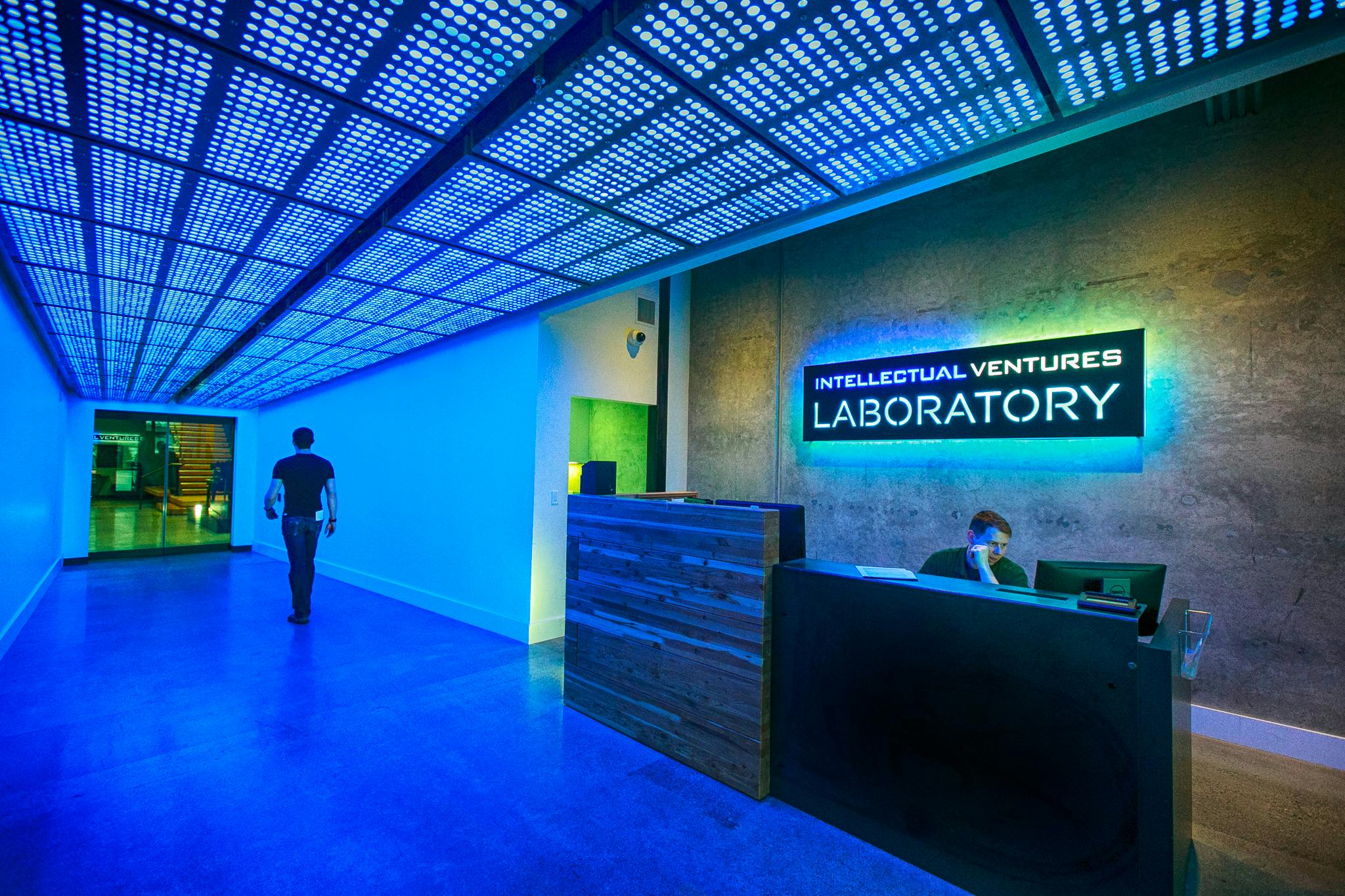 The entrance of Intellectual Ventures. The ceiling is a grid of dots, projecting blue light. 