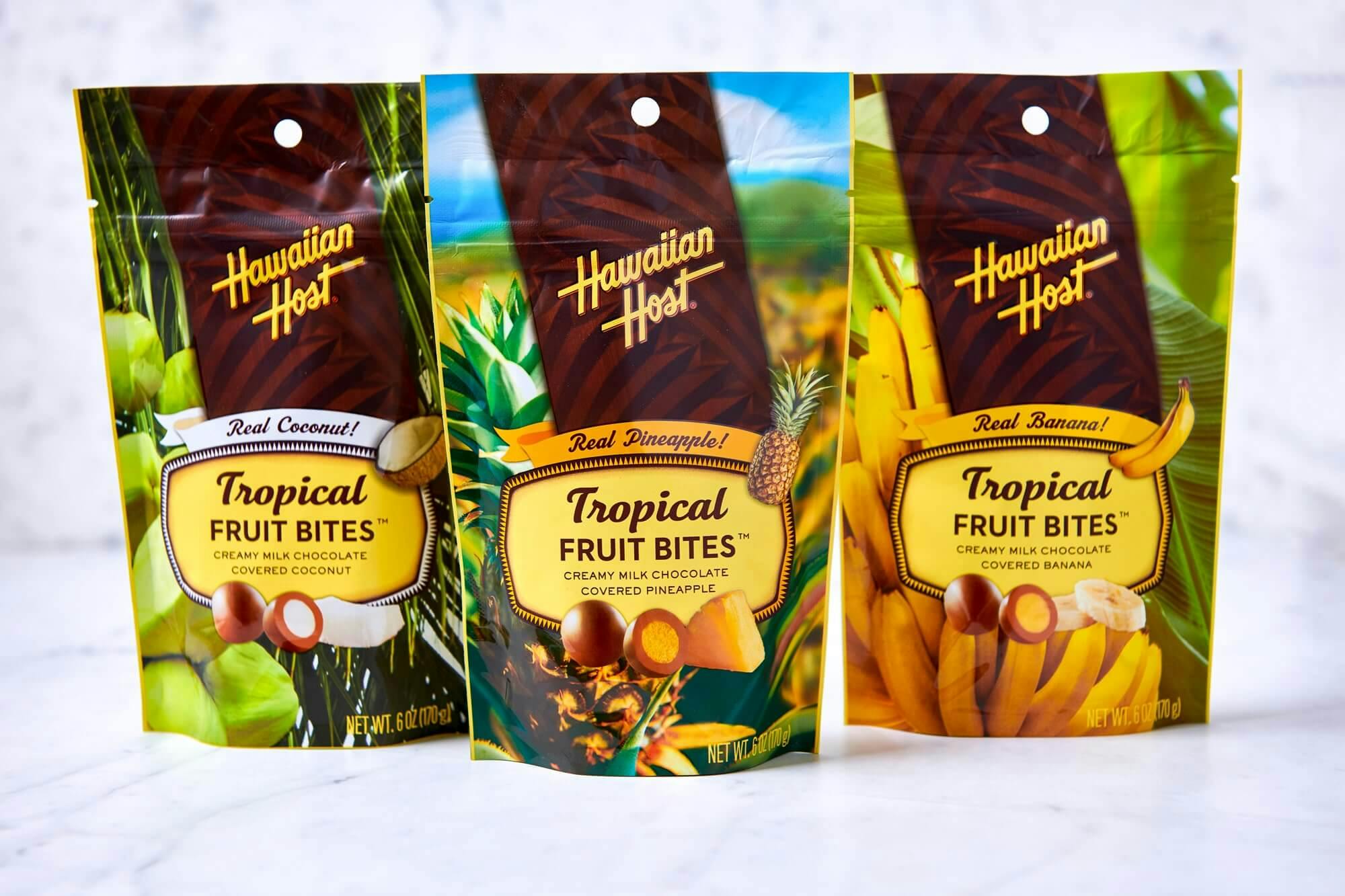 The design for the Tropical Fruit Bites packaging is displayed on Fruit Bite bags: Coconut, Pineapple, and Banana.