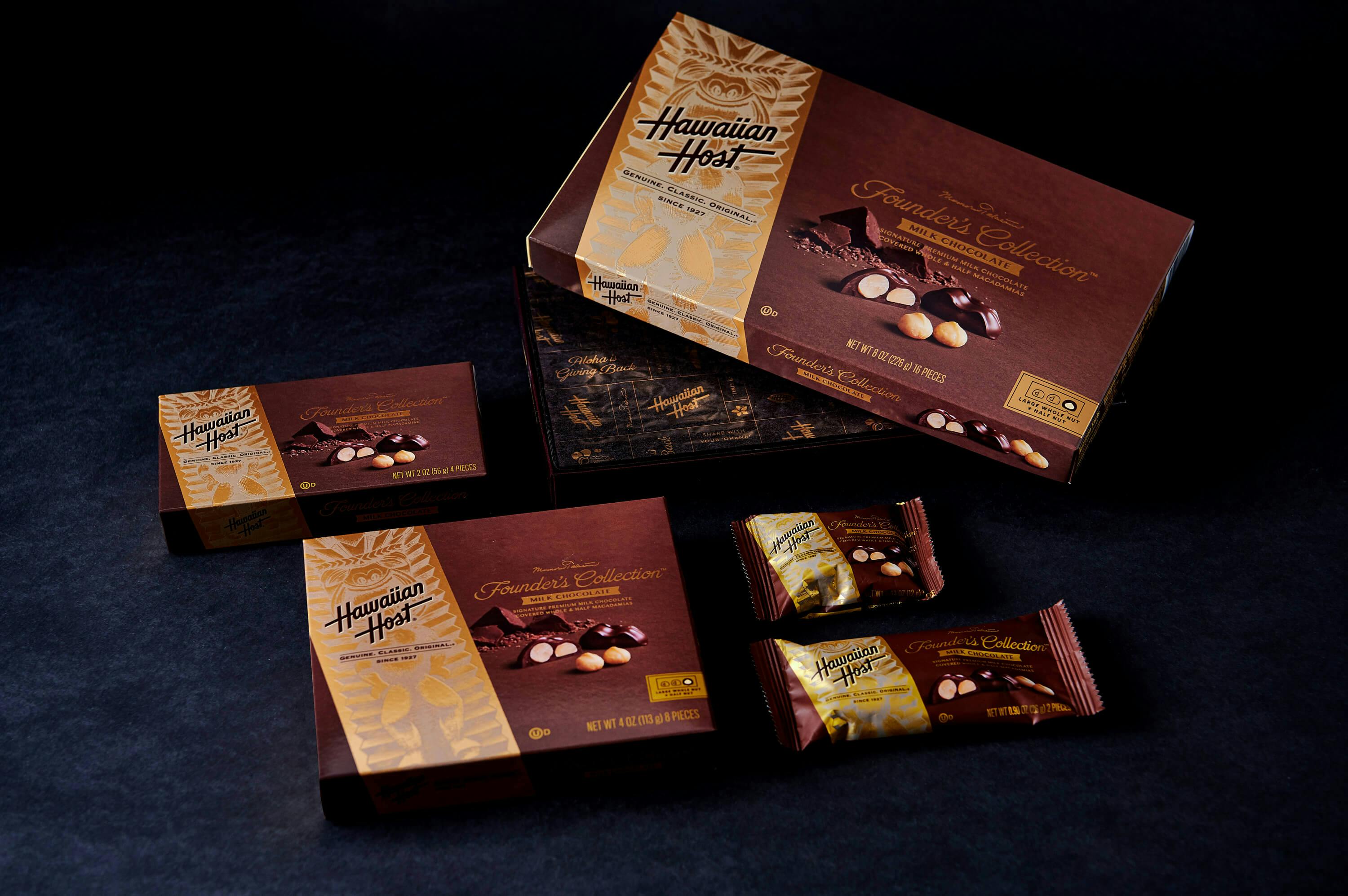 The packaging of the Founders Collection Box in three sizes and with two differently sized individually wrapped chocolates.