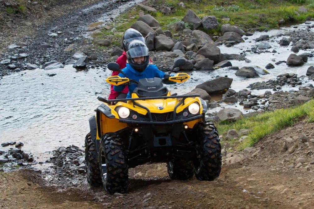 Two people on an atv through Iceland's landscapes