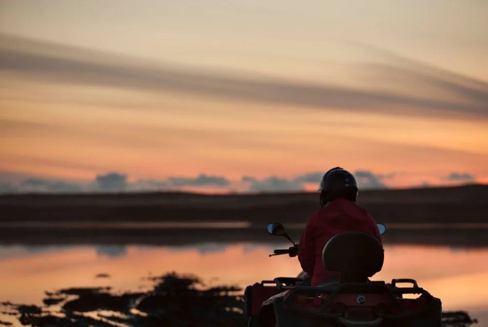 Solo ATV Rider at Icelandic Midnight Sunset