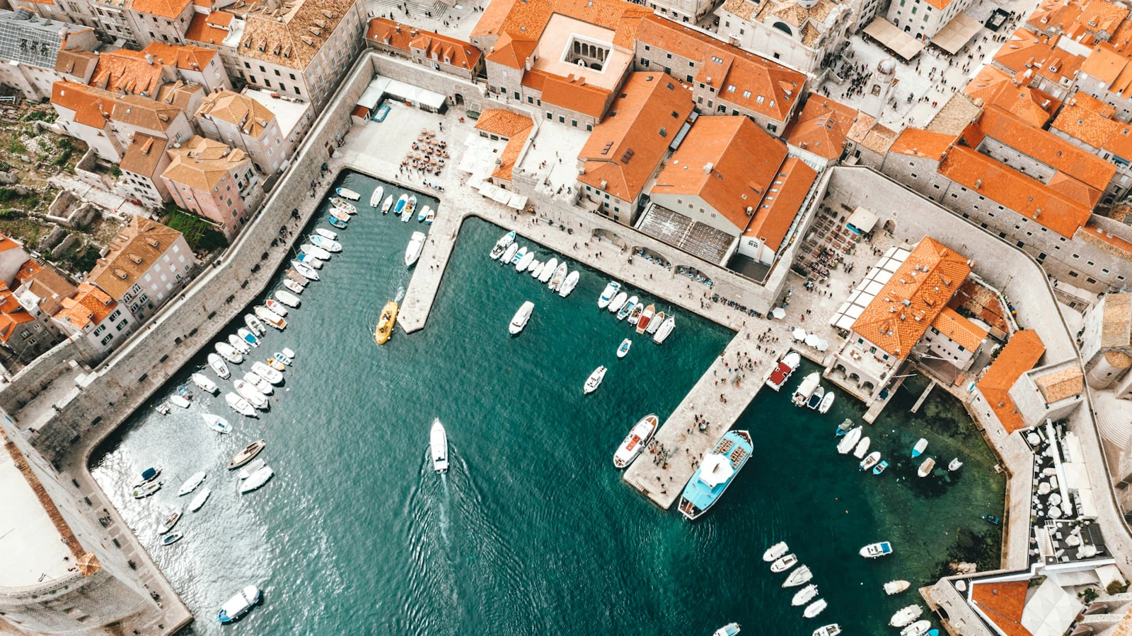 Aerial view of boats along a busy Croatian marina pier