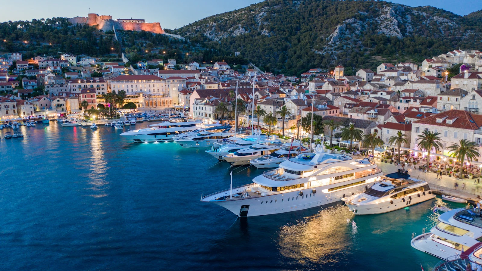 Boats along a Croatian waterfront with town buildings behind