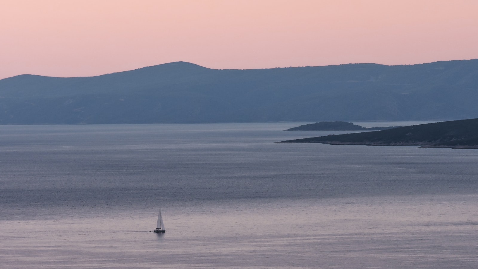 Sailboat at dusk near Brač island, Croatia