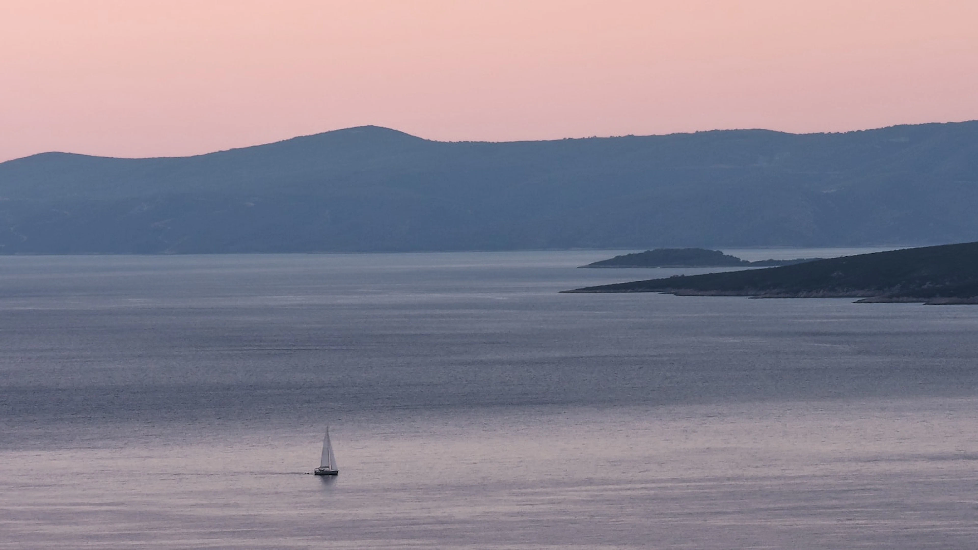 Sailboat at dusk near Brač island, Croatia
