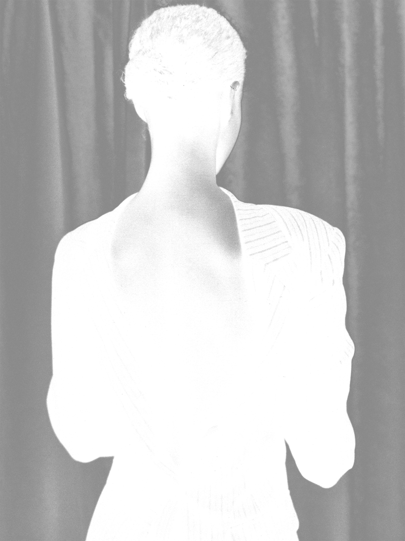 Silhouette of a woman facing forward