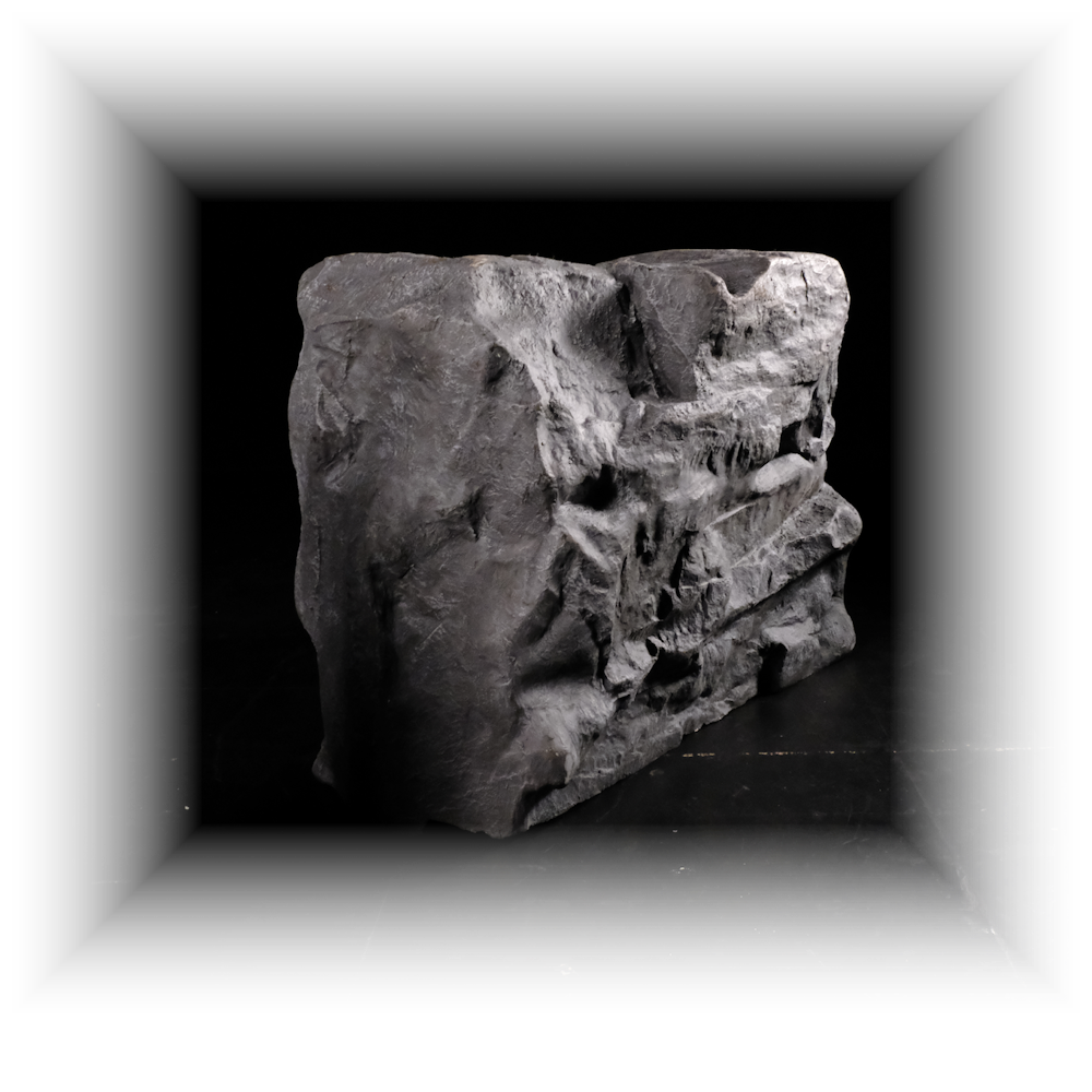 3D graphic of a rock sitting in a black square void