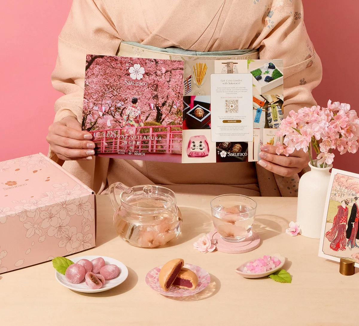 A woman in a kimono pours tea