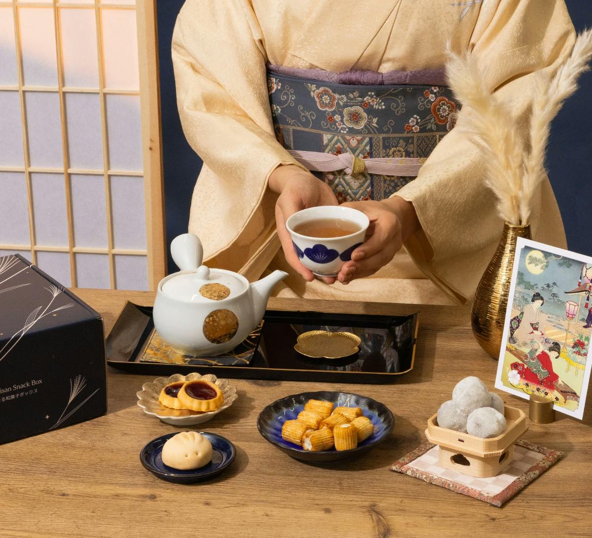 Woman in traditional kimono prepares tea.