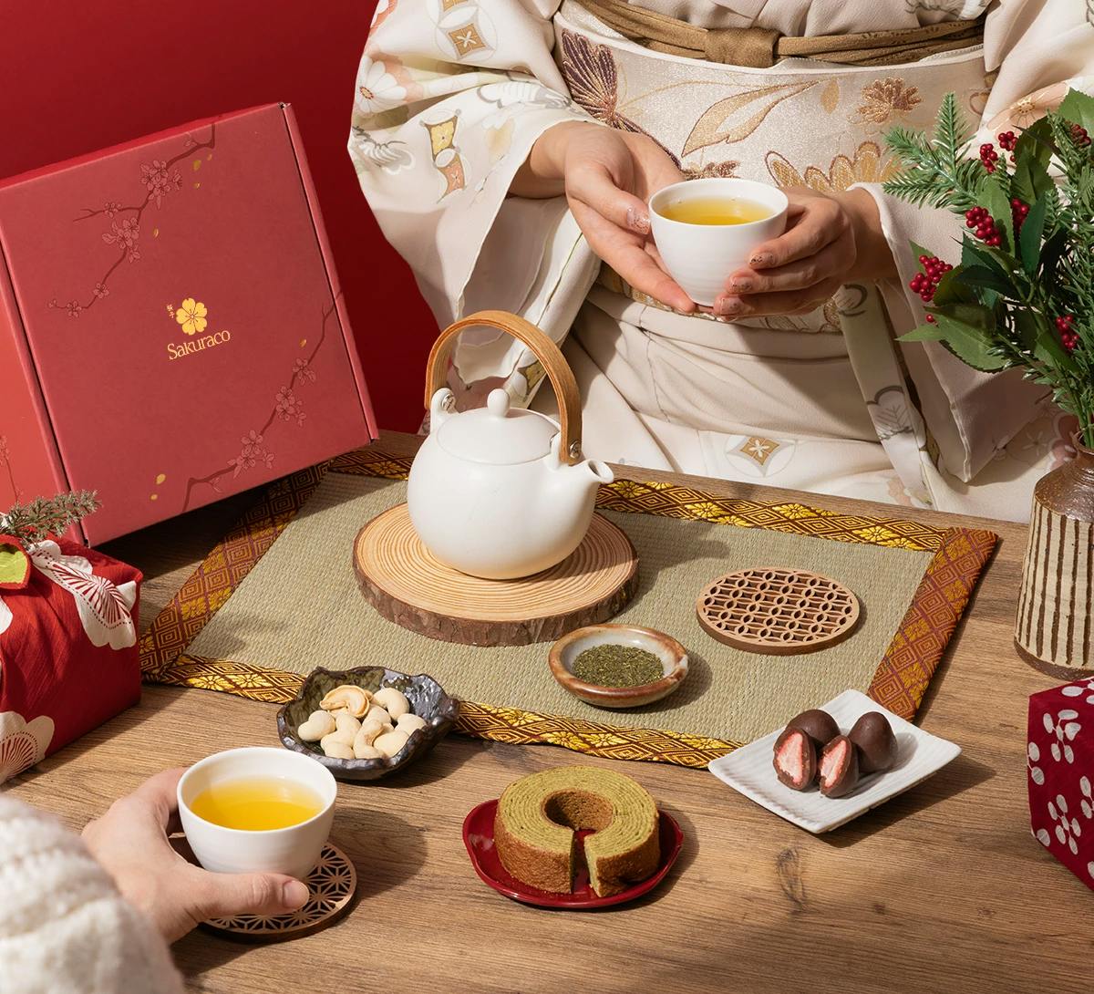 A woman in kimono enjoys Japanese wagashi snacks from Sakuraco.