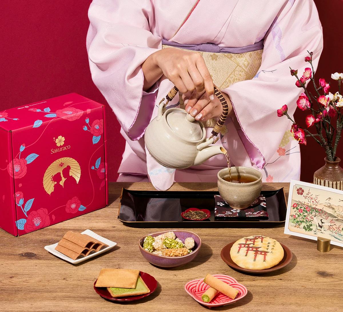 A woman in kimono enjoys Japanese wagashi snacks from Sakuraco.