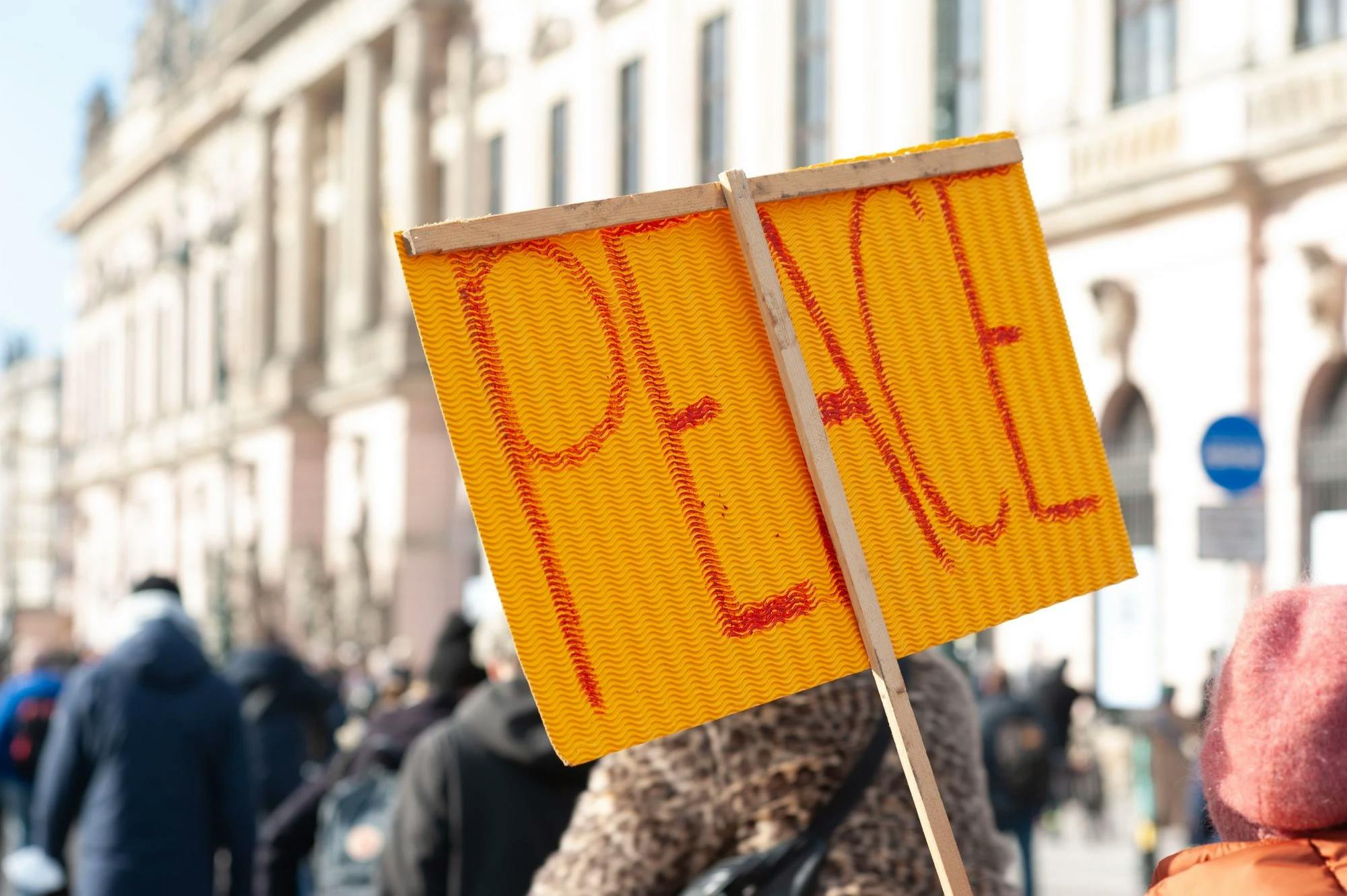 A photo of a peace sign at a protest