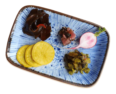 pickled vegetables on a blue plate