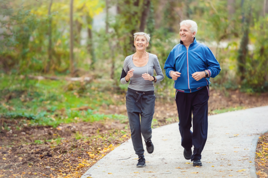 A man and a woman running on the open road