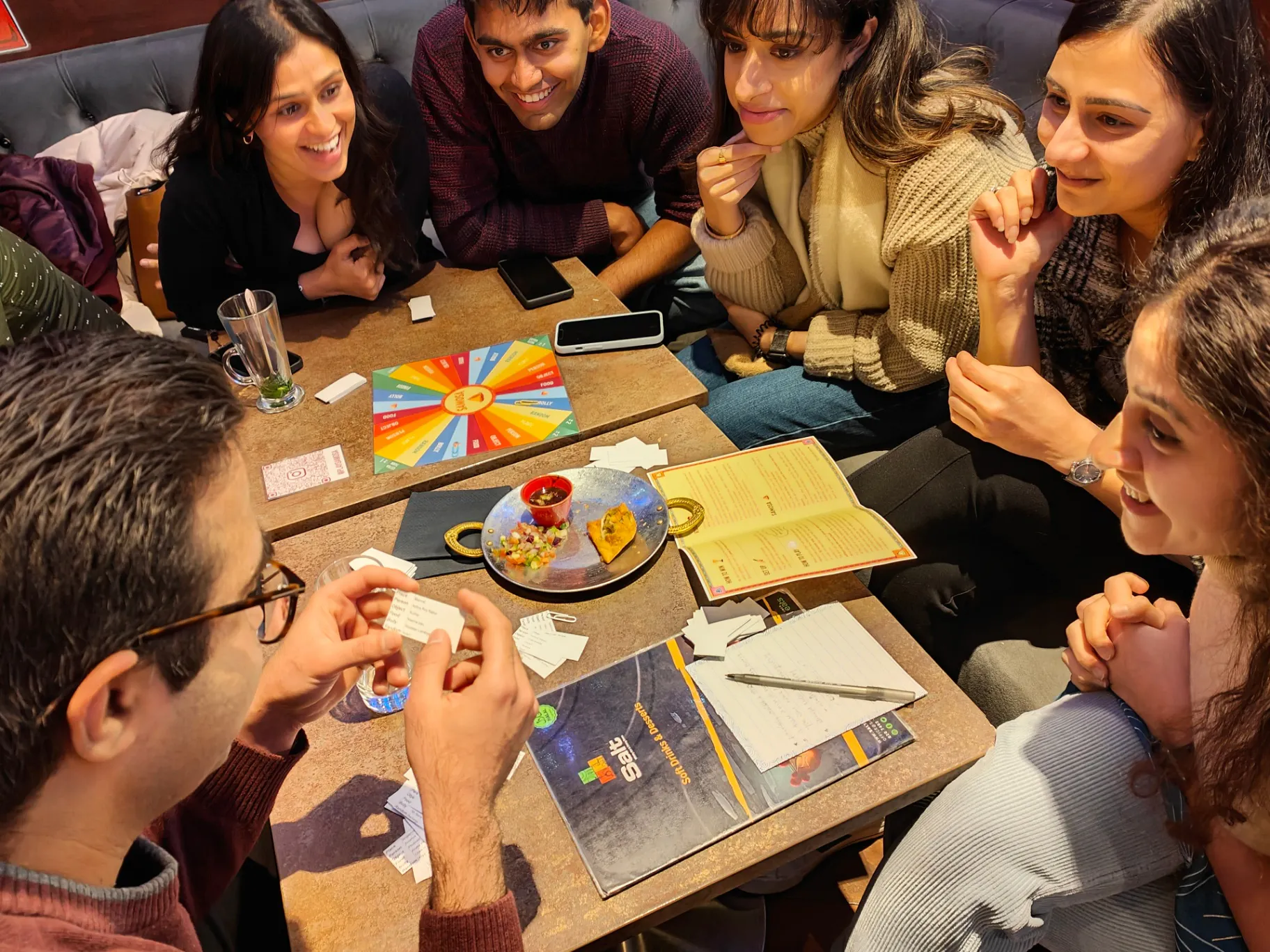 Friends enjoying SAMOSA game night