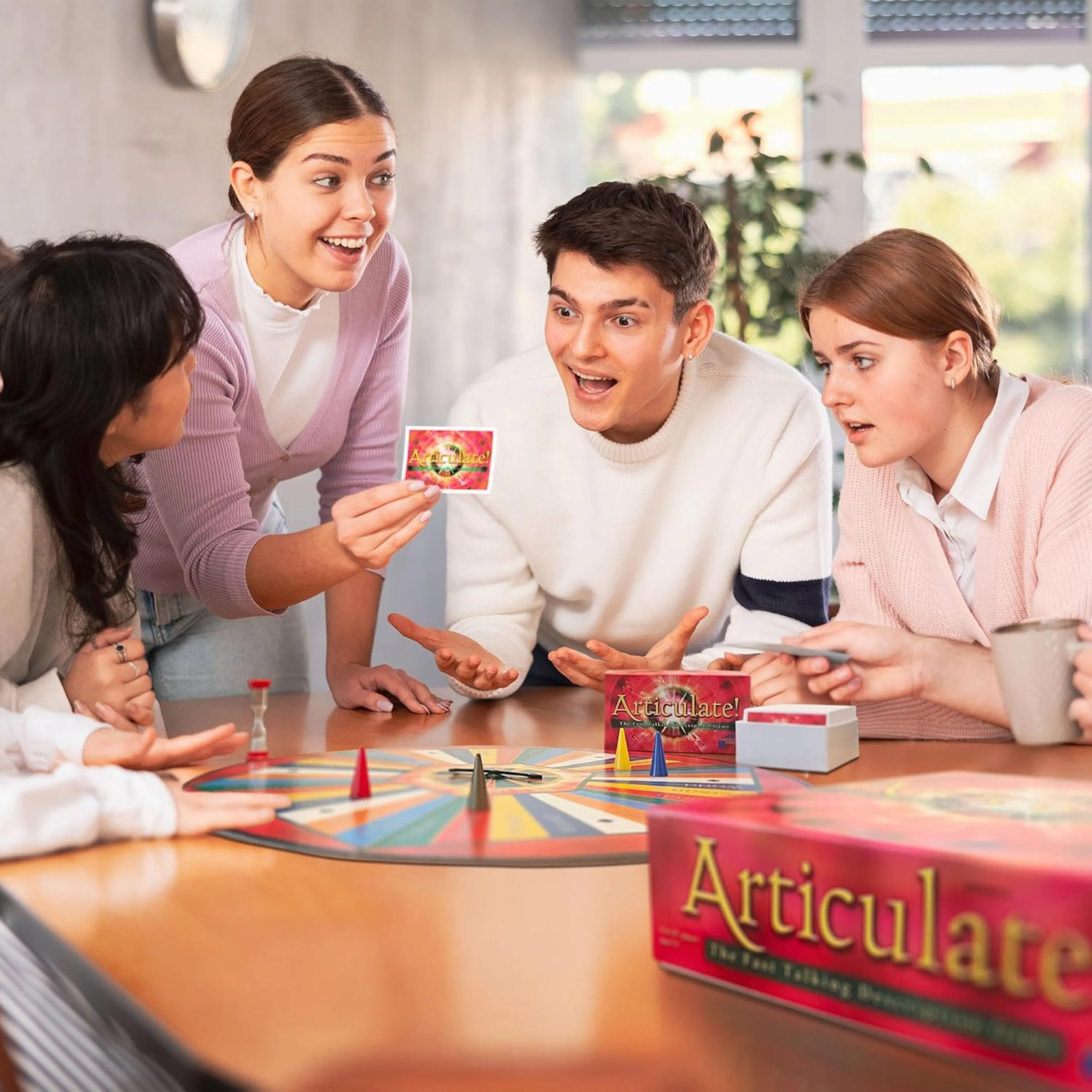 Friends playing Articulate board game