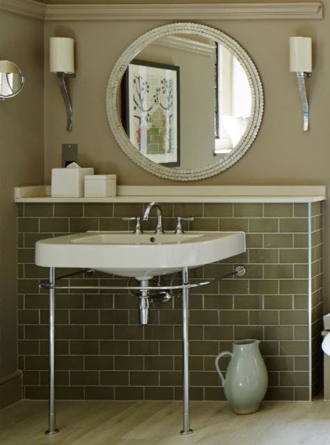 Samuel Heath traditional Fairfield brass tap in a chrome finish. Mounted on vanity unit with green tiles.