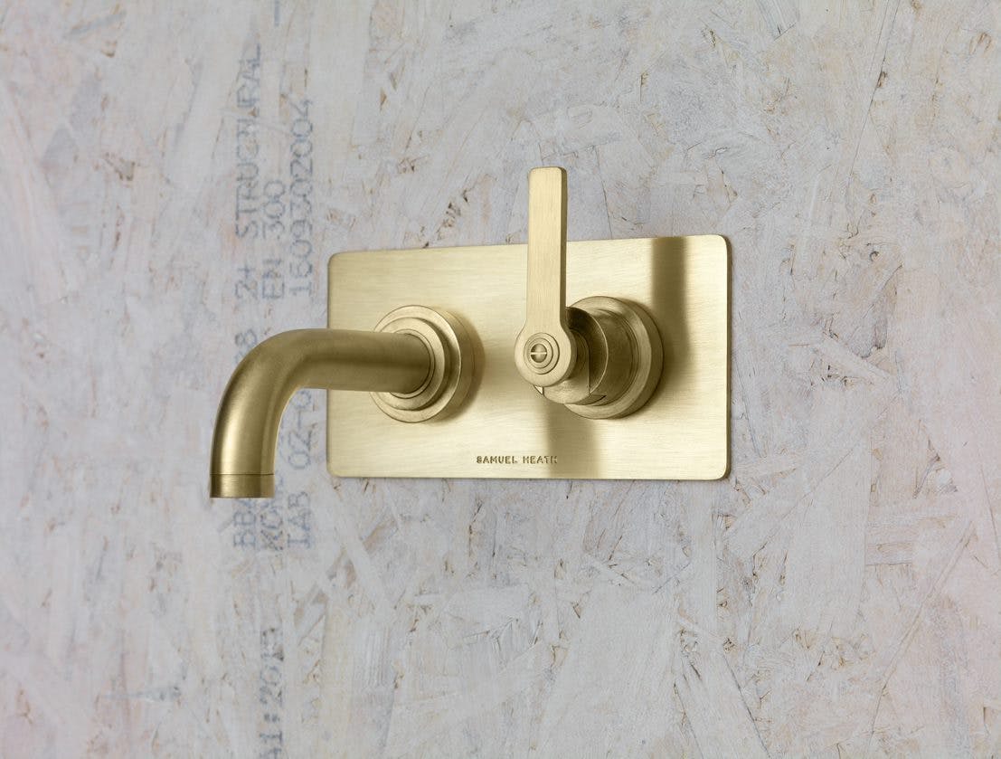 Samuel Heath Landmark Pure Bauhaus inspired wall mounted single lever tap in a natural urban brass finish which will patina.