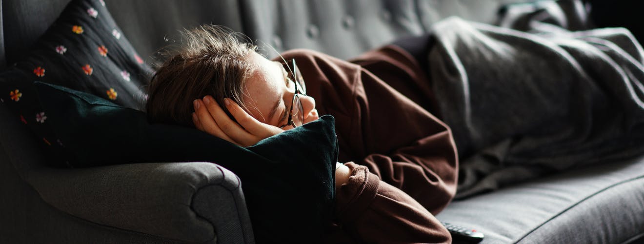 cbn isolate - woman resting on couch