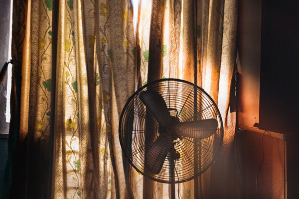 fan by window for help falling asleep