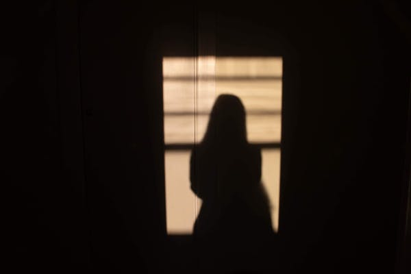 shadow of a woman who cannot sleep due to sleep apnea